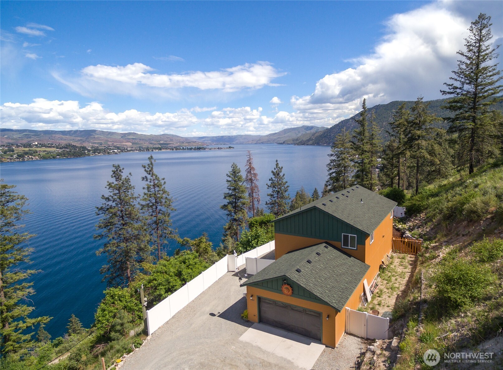 165 Granite Falls Road Chelan, WA 98816 - Photo 2 of 27 an aerial view of a house with lake view