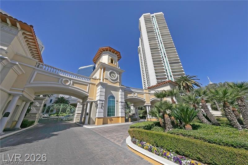 2747 Paradise Road, Unit 1706 Las Vegas, NV 89109 - Photo 34 of 35 A grand gated entrance welcomes residents to a resort-style community with a towering high-rise.