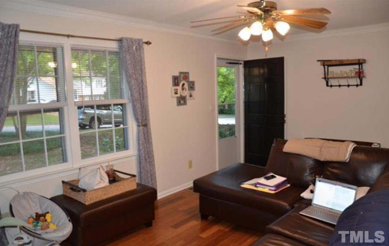 7809 Hemlock Court Raleigh, NC 27615 - Photo 4 of 16 a living room with furniture and a window