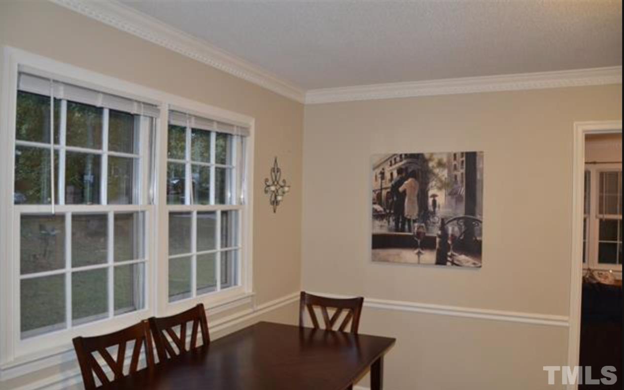 7809 Hemlock Court Raleigh, NC 27615 - Photo 5 of 16 a view of a workspace with furniture and a window