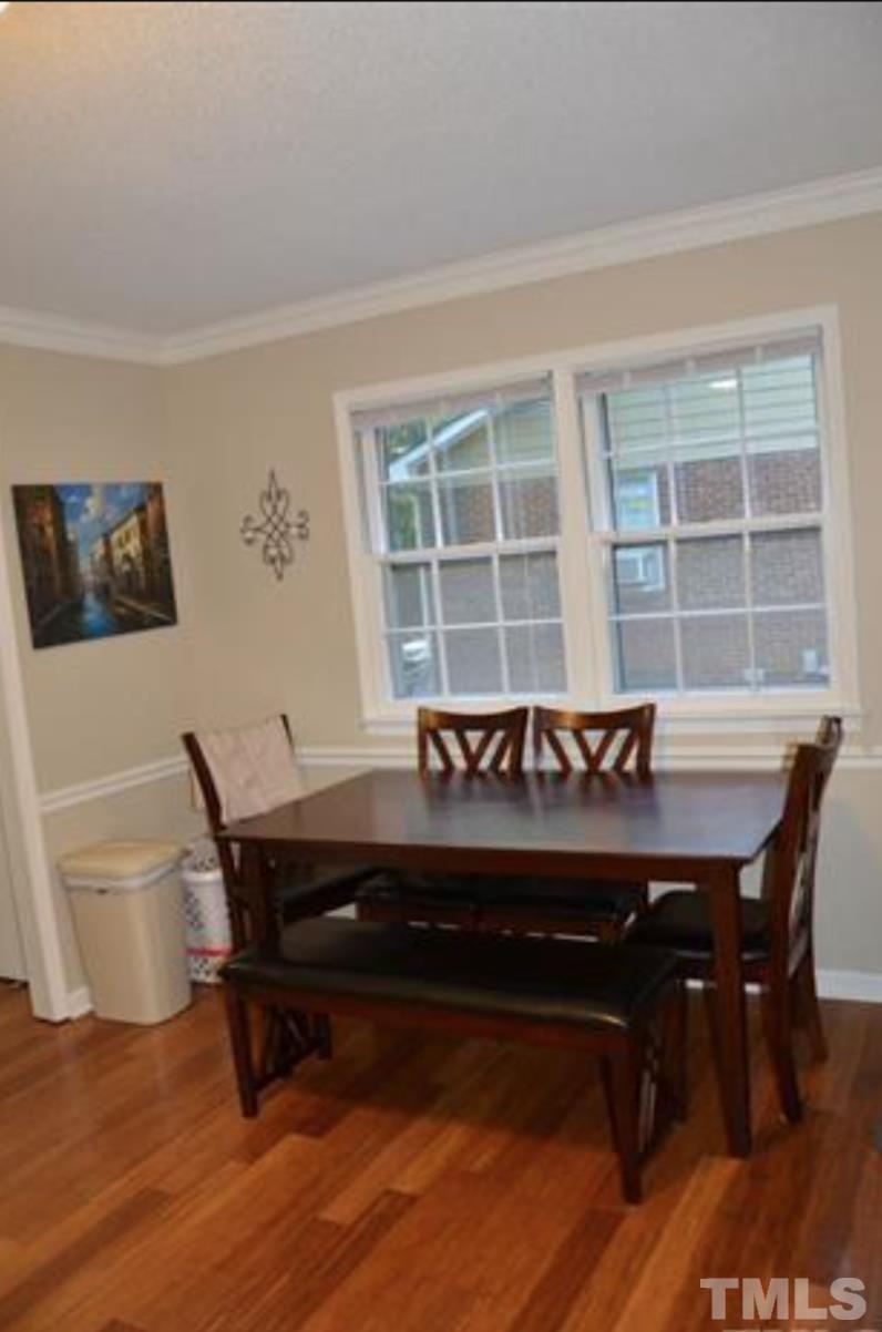 7809 Hemlock Court Raleigh, NC 27615 - Photo 6 of 16 a view of a dining room with furniture and window