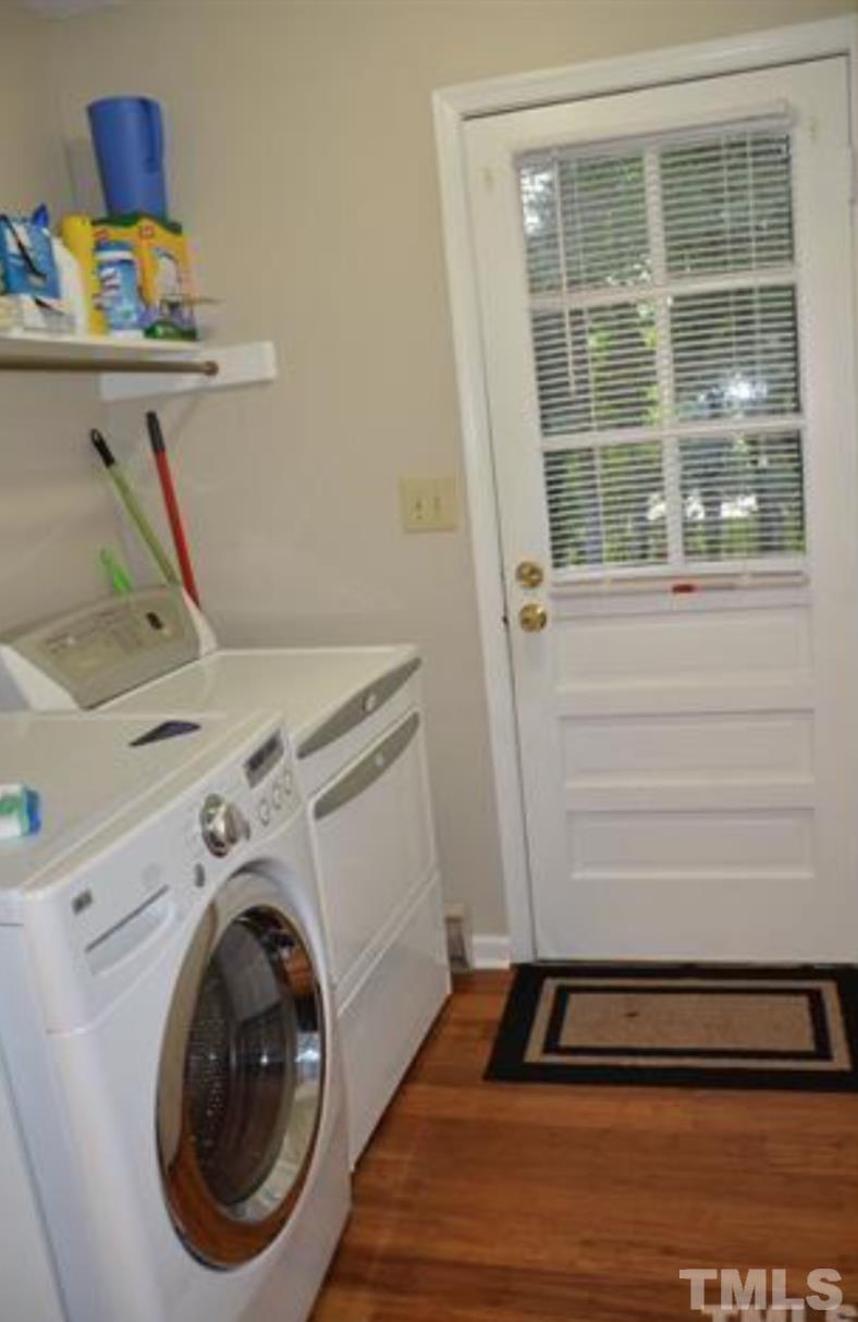7809 Hemlock Court Raleigh, NC 27615 - Photo 7 of 16 a utility room with dryer and washer