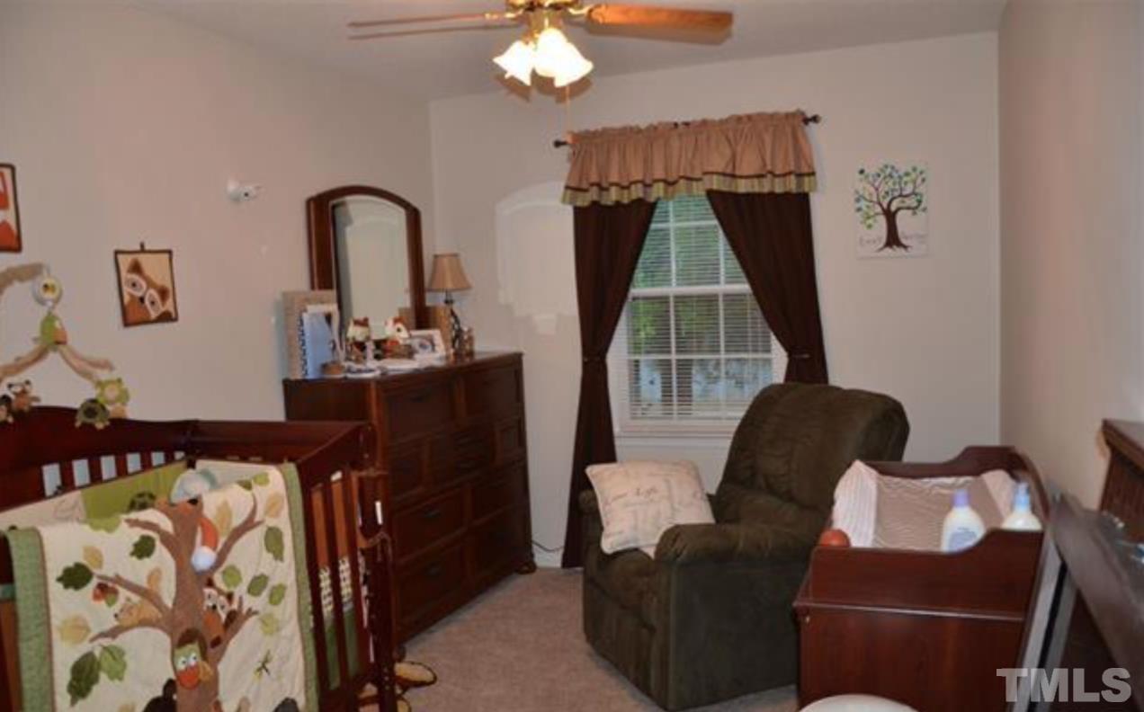 7809 Hemlock Court Raleigh, NC 27615 - Photo 10 of 16 a living room with furniture and a window