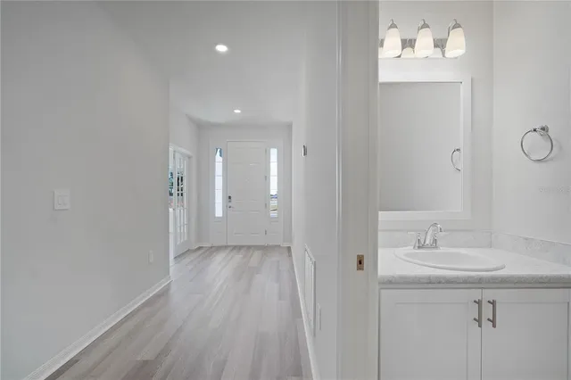 a bathroom with a toilet a sink and a shower