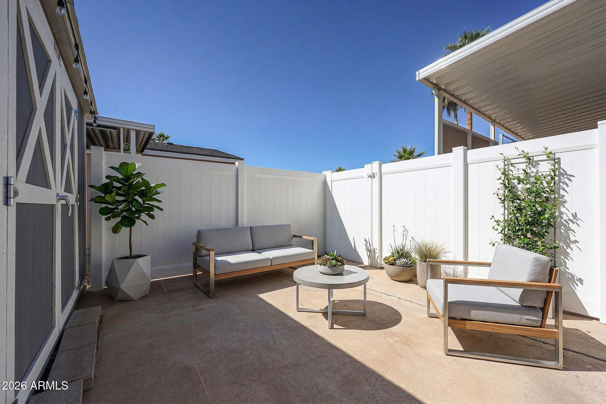 201 South Greenfield Road, Unit 254 Mesa, AZ 85206 - Photo 17 of 35 a view of a patio with couches and potted plants with sky view