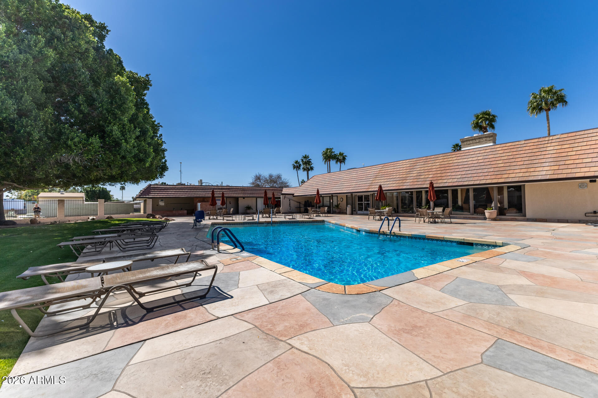 201 South Greenfield Road, Unit 254 Mesa, AZ 85206 - Photo 3 of 35 a front view of a house with swimming pool