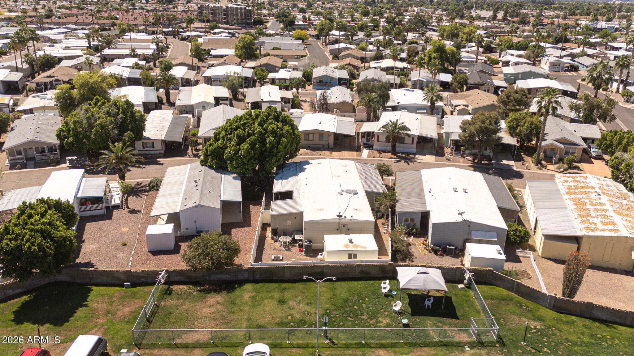 201 South Greenfield Road, Unit 254 Mesa, AZ 85206 - Photo 34 of 35 an aerial view of a house with a swimming pool and outdoor seating