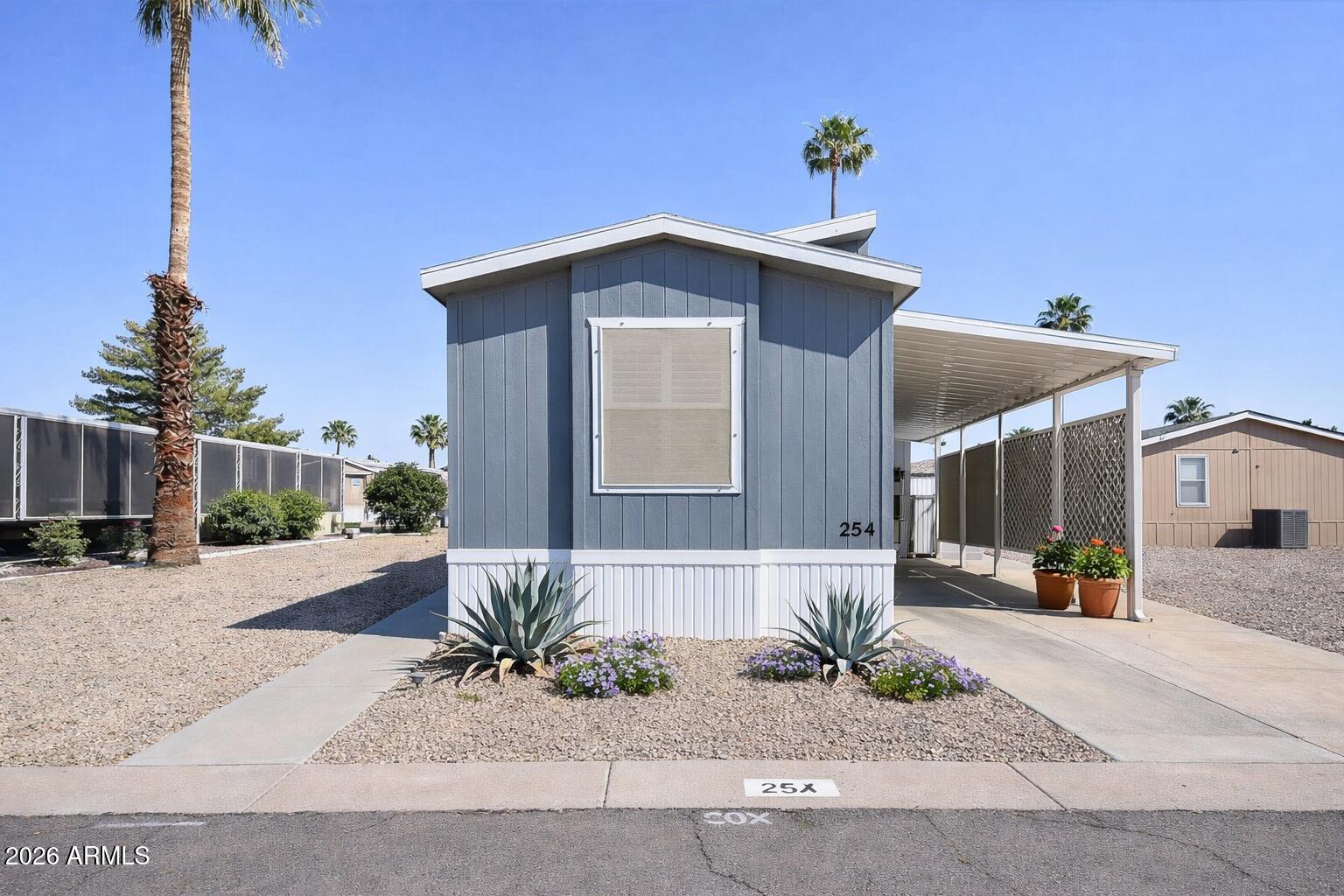 201 South Greenfield Road, Unit 254 Mesa, AZ 85206 - Photo 4 of 35 a front view of a house with a yard