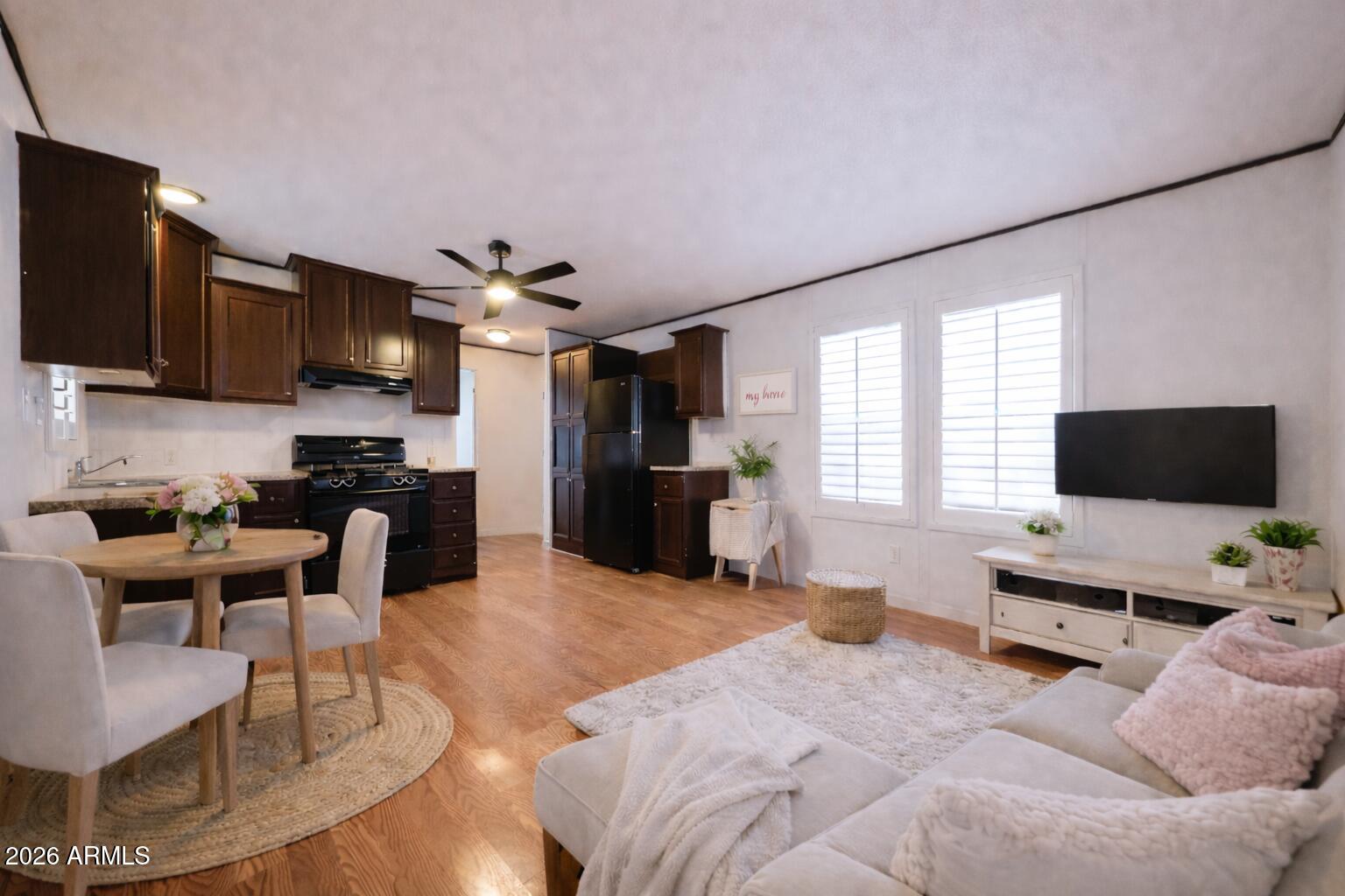 201 South Greenfield Road, Unit 254 Mesa, AZ 85206 - Photo 6 of 35 a living room with furniture and a flat screen tv
