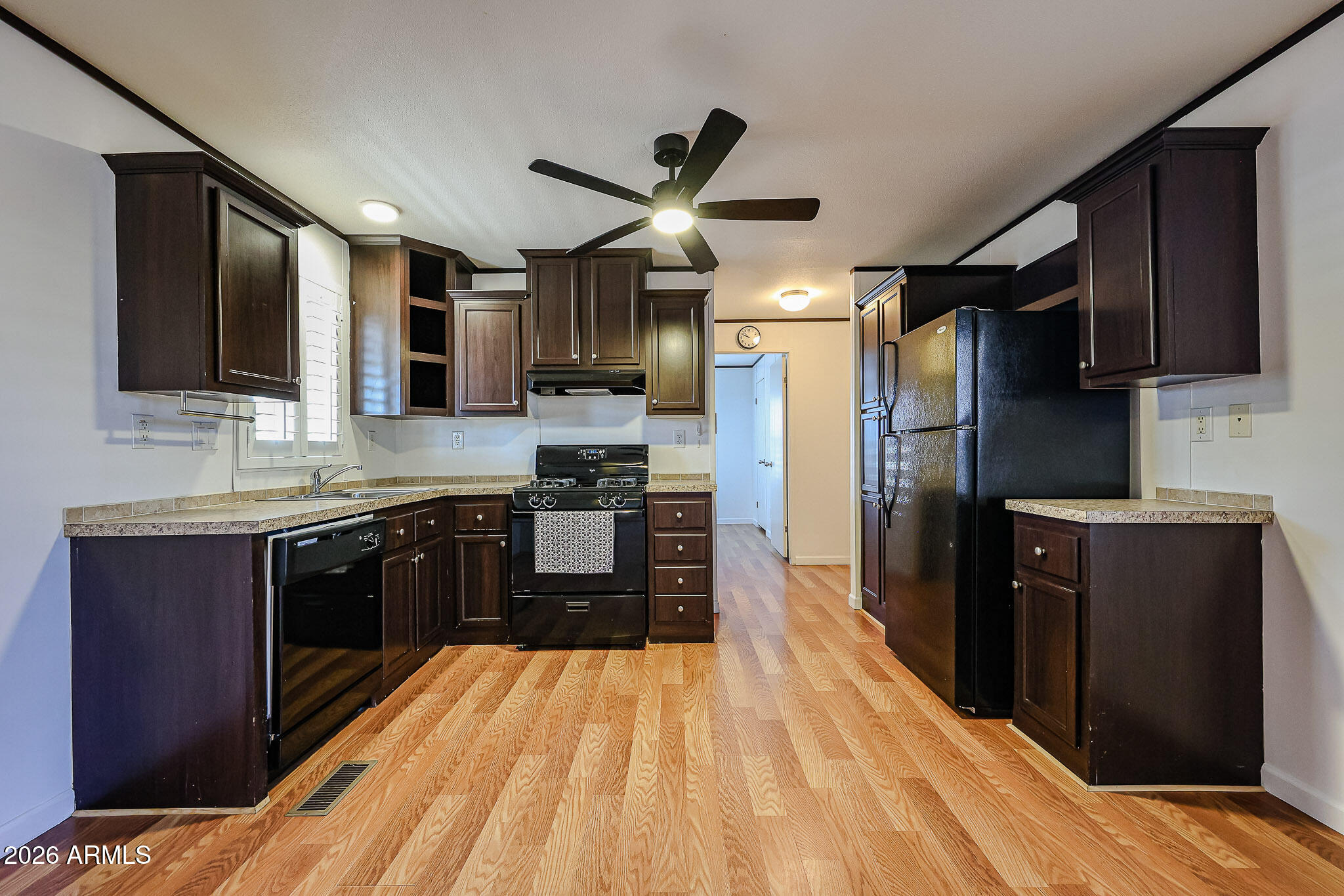 201 South Greenfield Road, Unit 254 Mesa, AZ 85206 - Photo 8 of 35 a kitchen with stainless steel appliances granite countertop a refrigerator a stove top oven a sink and dishwasher