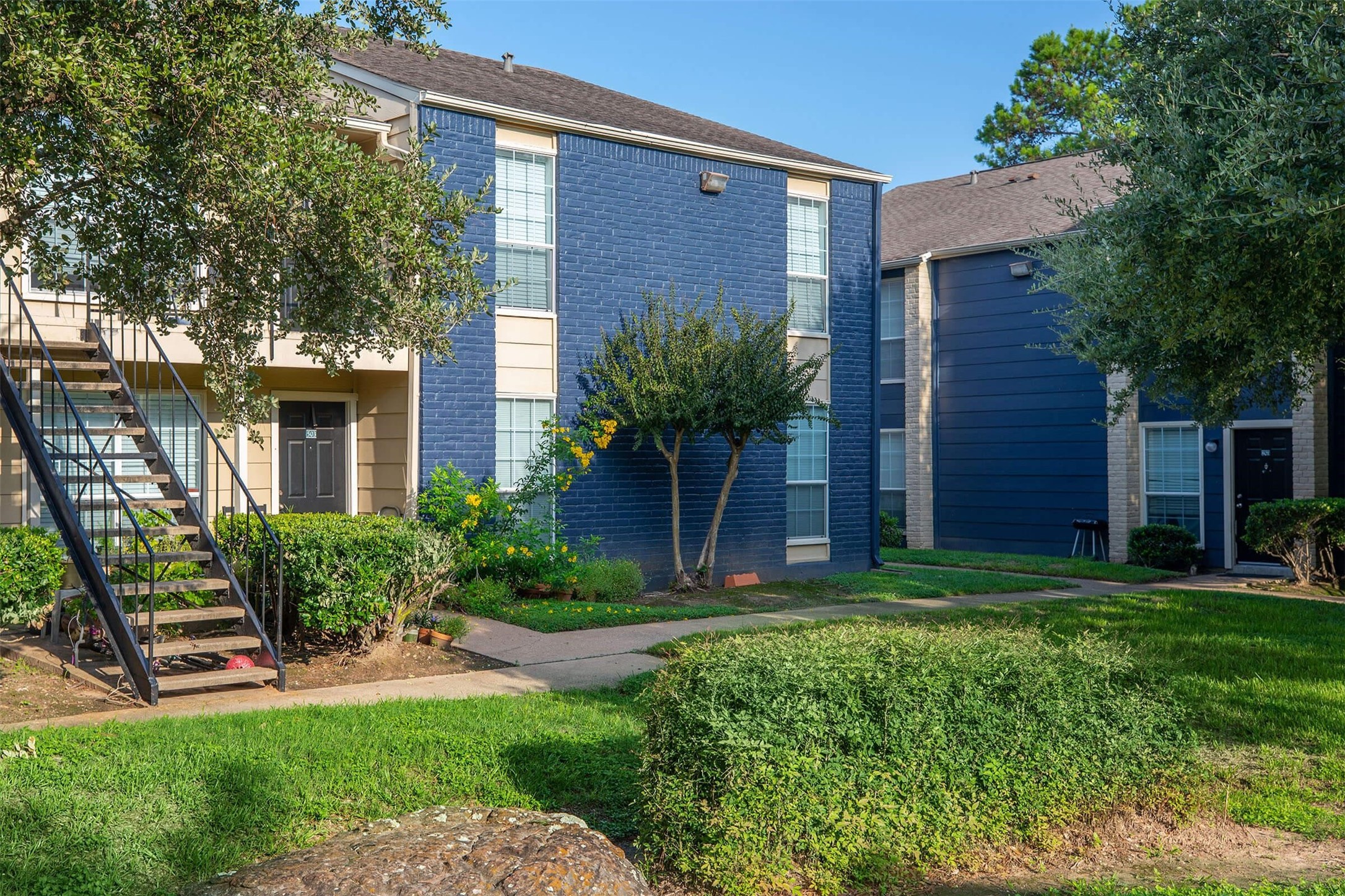 1100 Graham Drive, Unit 1602 Tomball, TX 77375 - Photo 22 of 27 a front view of a house with a yard
