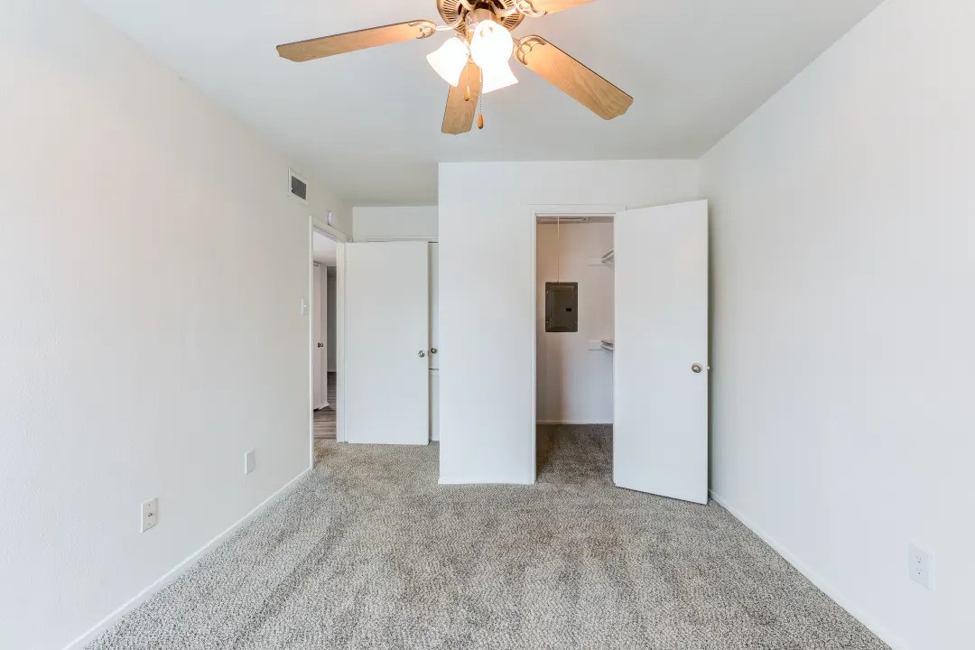 1100 Graham Drive, Unit 1602 Tomball, TX 77375 - Photo 10 of 27 wooden floor in an empty room