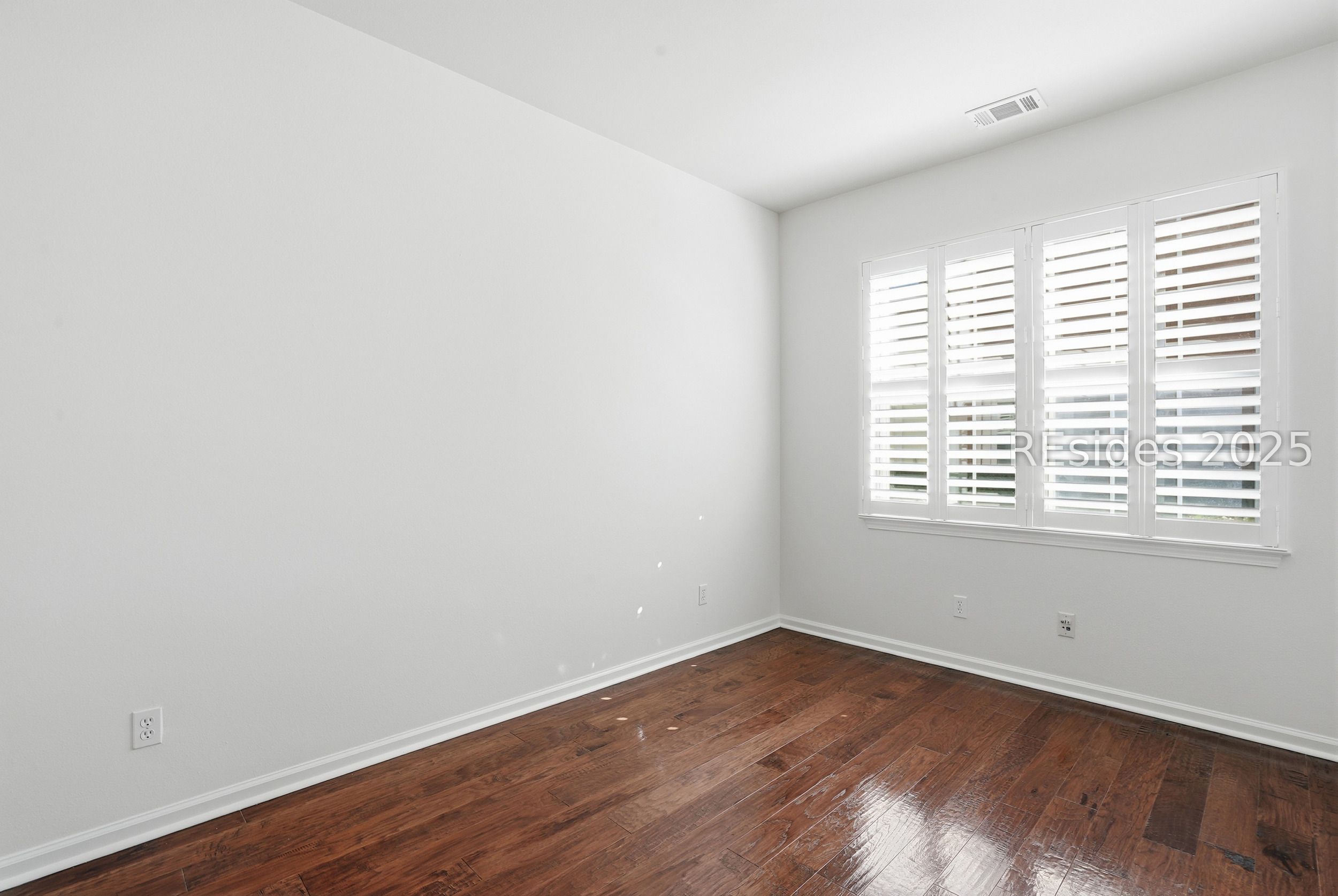 11 Seaford Place Bluffton, SC 29909 - Photo 23 of 40 Plantation Shutters in Den