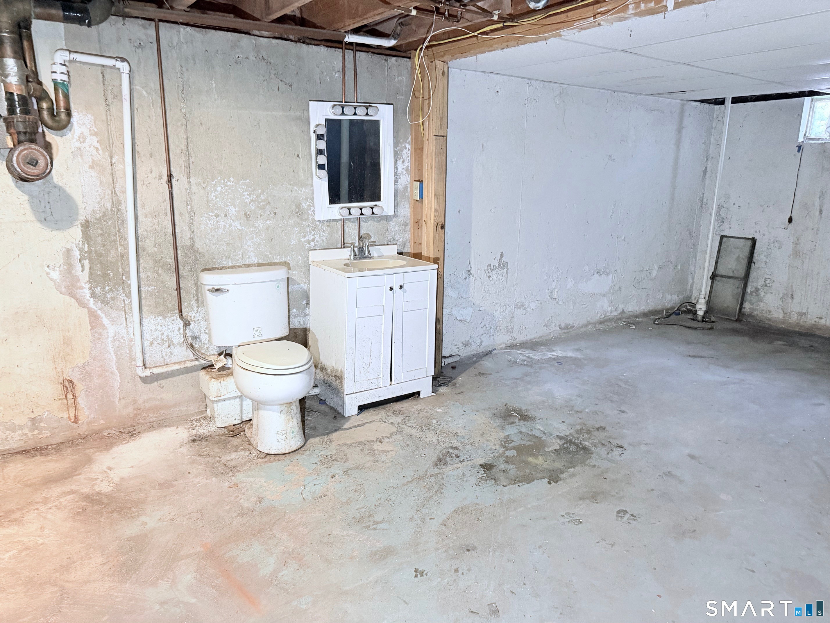 14 Wilson Lane Vernon, CT 06066 - Photo 12 of 19 a bathroom with a toilet sink a mirror and vanity