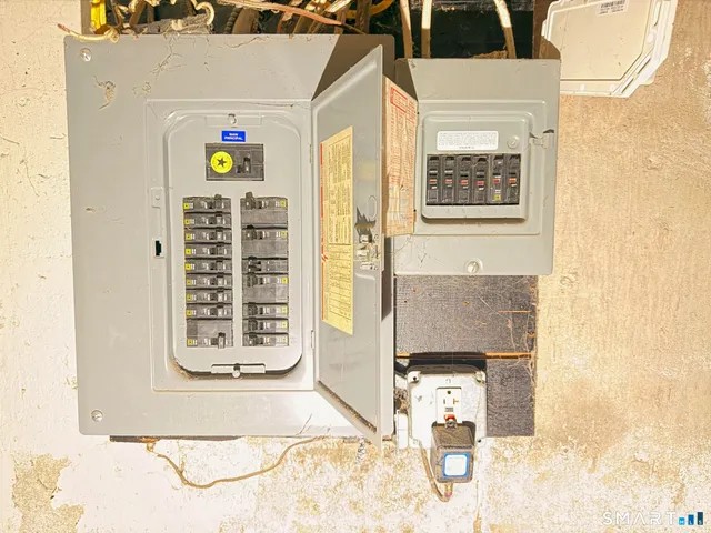 a picture of a bathroom with mirror and door