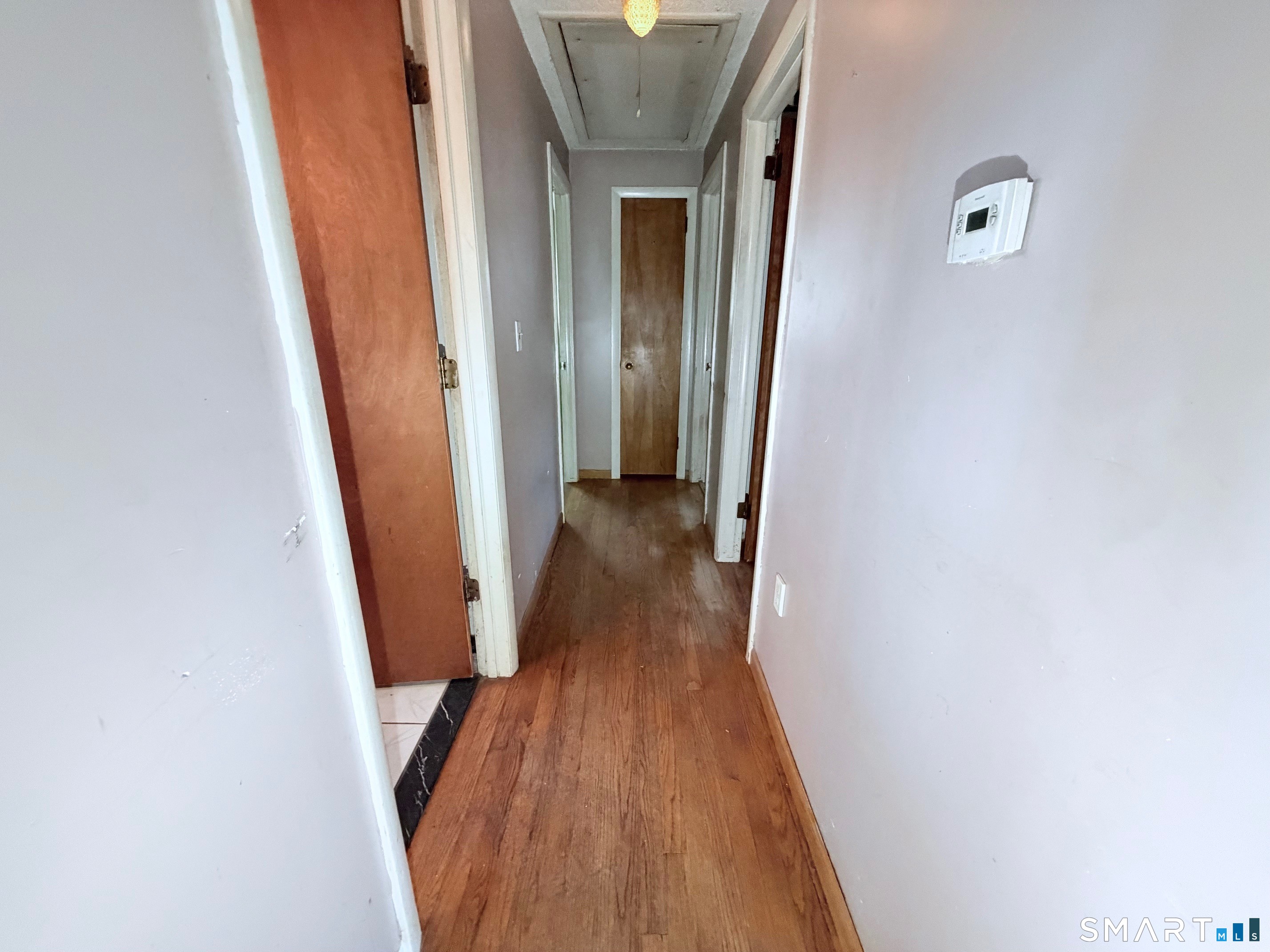 14 Wilson Lane Vernon, CT 06066 - Photo 5 of 19 a view of a hallway with wooden floor and staircase