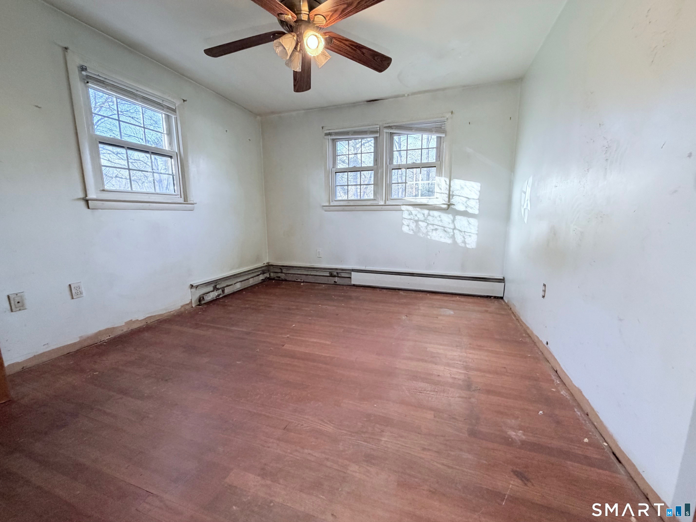 14 Wilson Lane Vernon, CT 06066 - Photo 7 of 19 an empty room with windows and fan