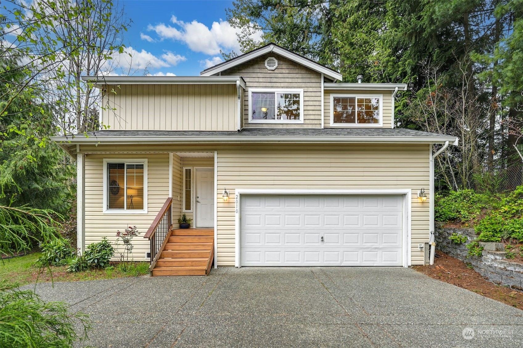 2010 Magnolia Road Lynnwood, WA 98036 - Photo 1 of 22 a front view of a house with a yard and garage