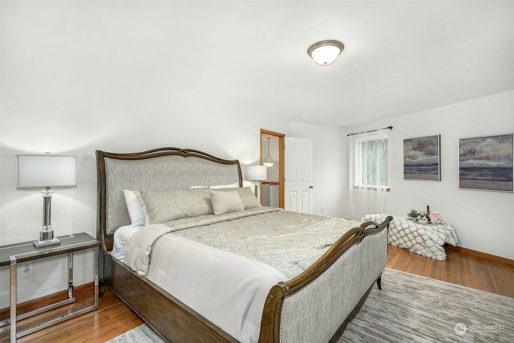 2010 Magnolia Road Lynnwood, WA 98036 - Photo 13 of 22 a bedroom with a bed and wooden floor