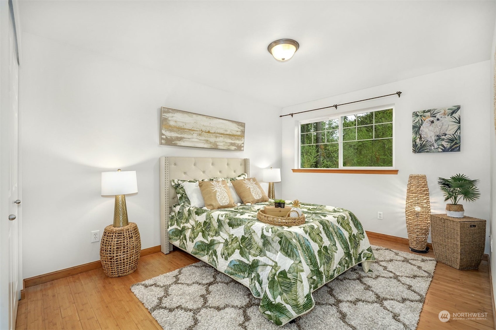 2010 Magnolia Road Lynnwood, WA 98036 - Photo 17 of 22 a bedroom with a bed and wooden floor