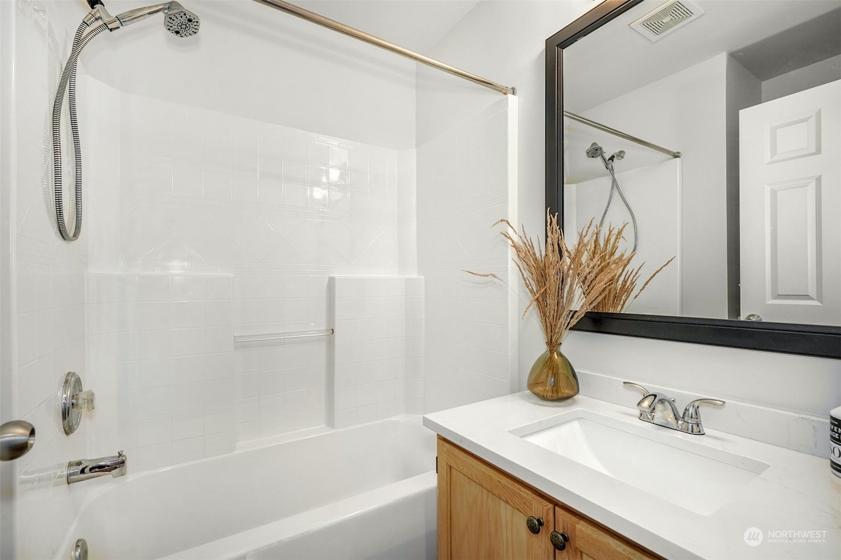 2010 Magnolia Road Lynnwood, WA 98036 - Photo 19 of 22 a bathroom with a sink vanity tub and a mirror