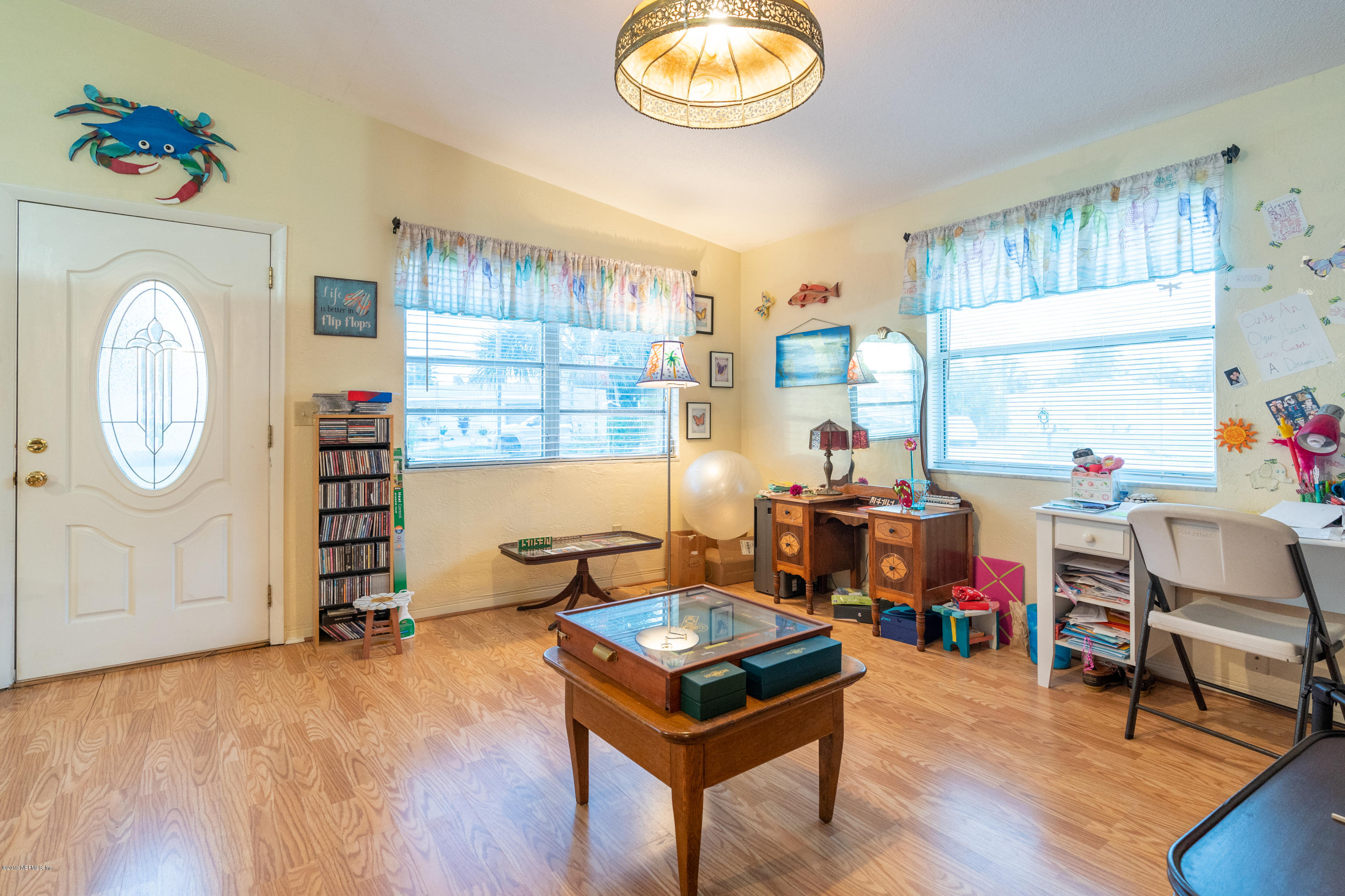 34 Ocean Drive St. Augustine, FL 32080 - Photo 12 of 36 a room with furniture and a large window
