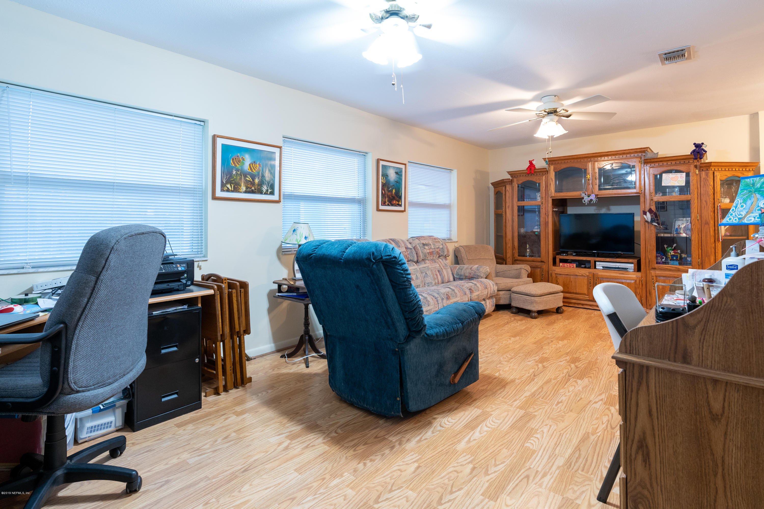 34 Ocean Drive St. Augustine, FL 32080 - Photo 21 of 36 a living room with furniture and a flat screen tv