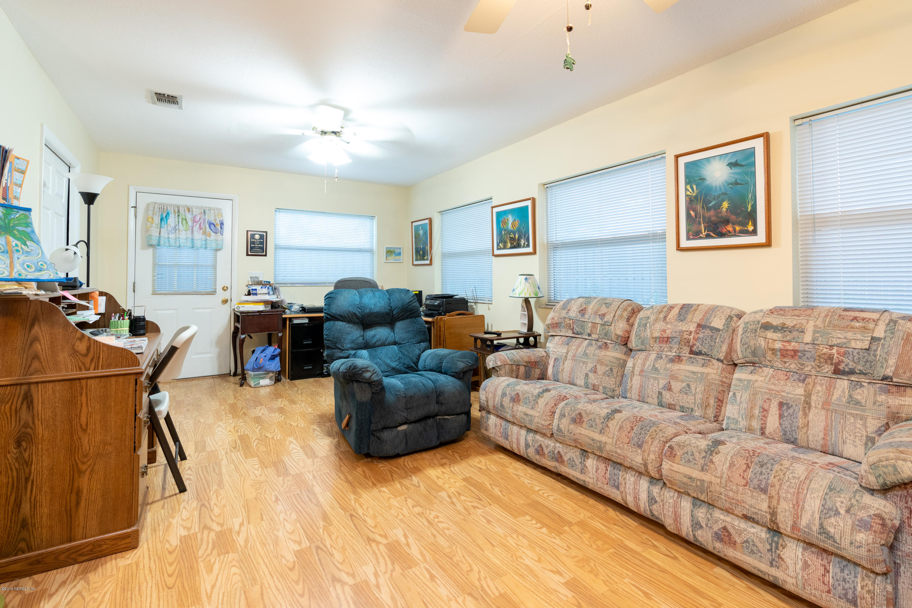 34 Ocean Drive St. Augustine, FL 32080 - Photo 22 of 36 a living room with furniture a chandelier