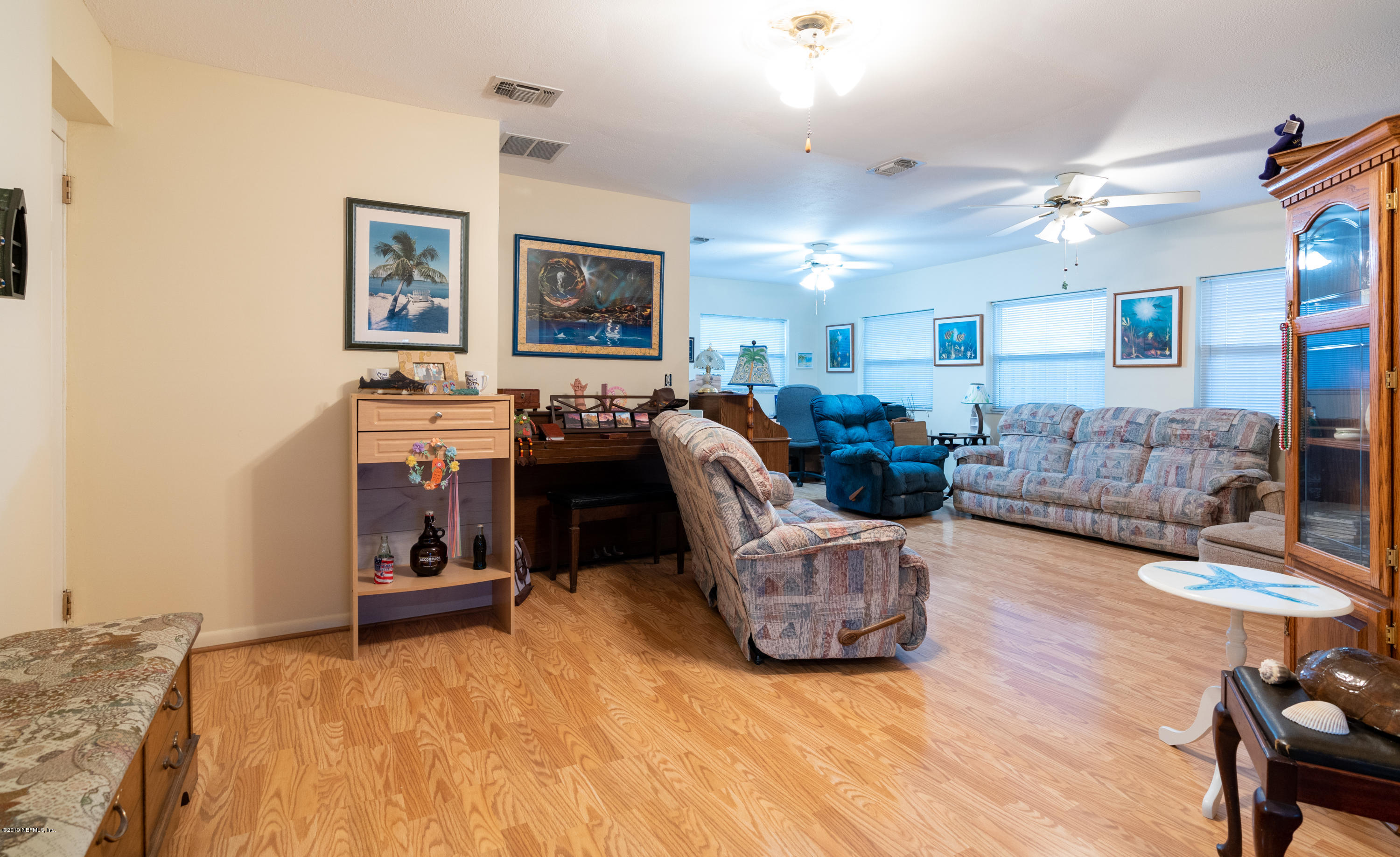 34 Ocean Drive St. Augustine, FL 32080 - Photo 23 of 36 a living room with furniture and a flat screen tv