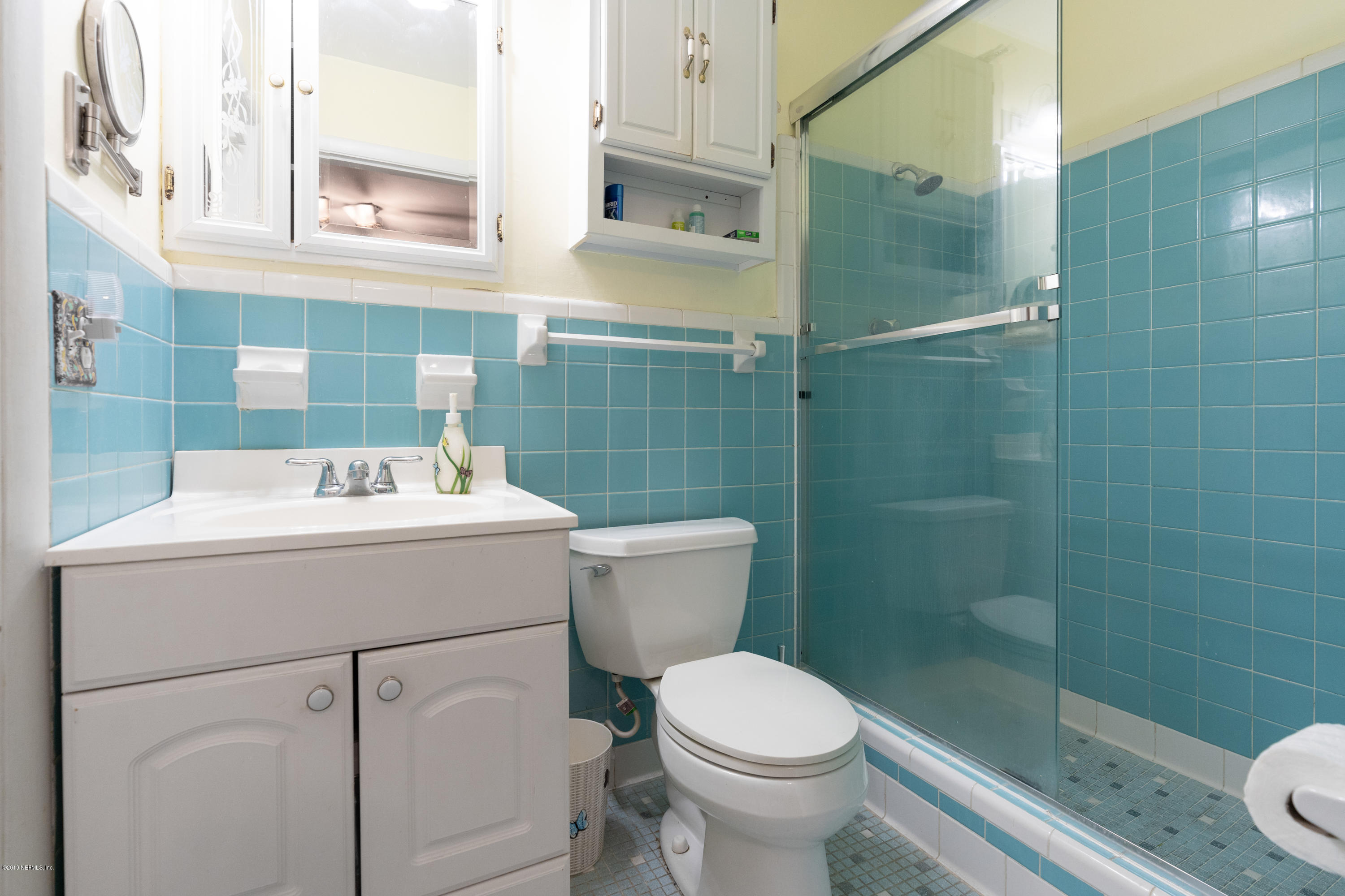 34 Ocean Drive St. Augustine, FL 32080 - Photo 28 of 36 a bathroom with a sink a toilet and shower