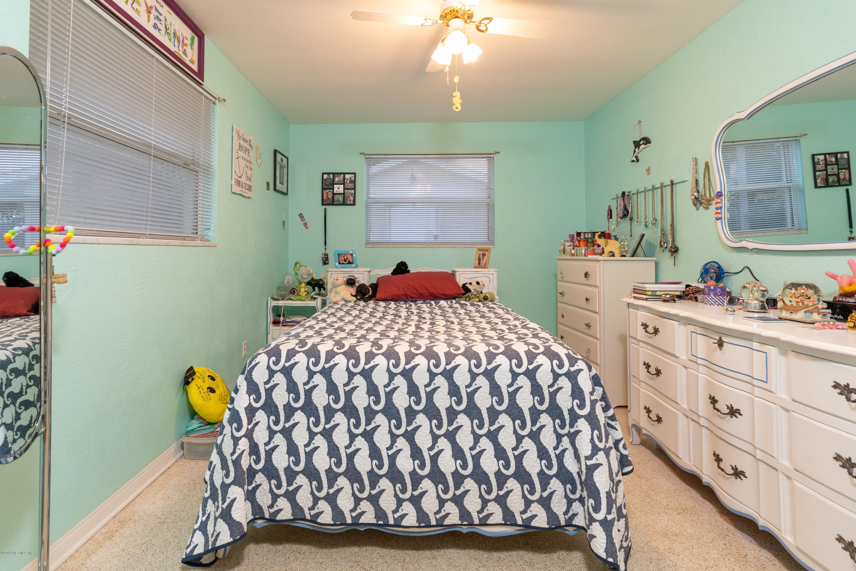 34 Ocean Drive St. Augustine, FL 32080 - Photo 30 of 36 a bedroom with a bed a window and dresser