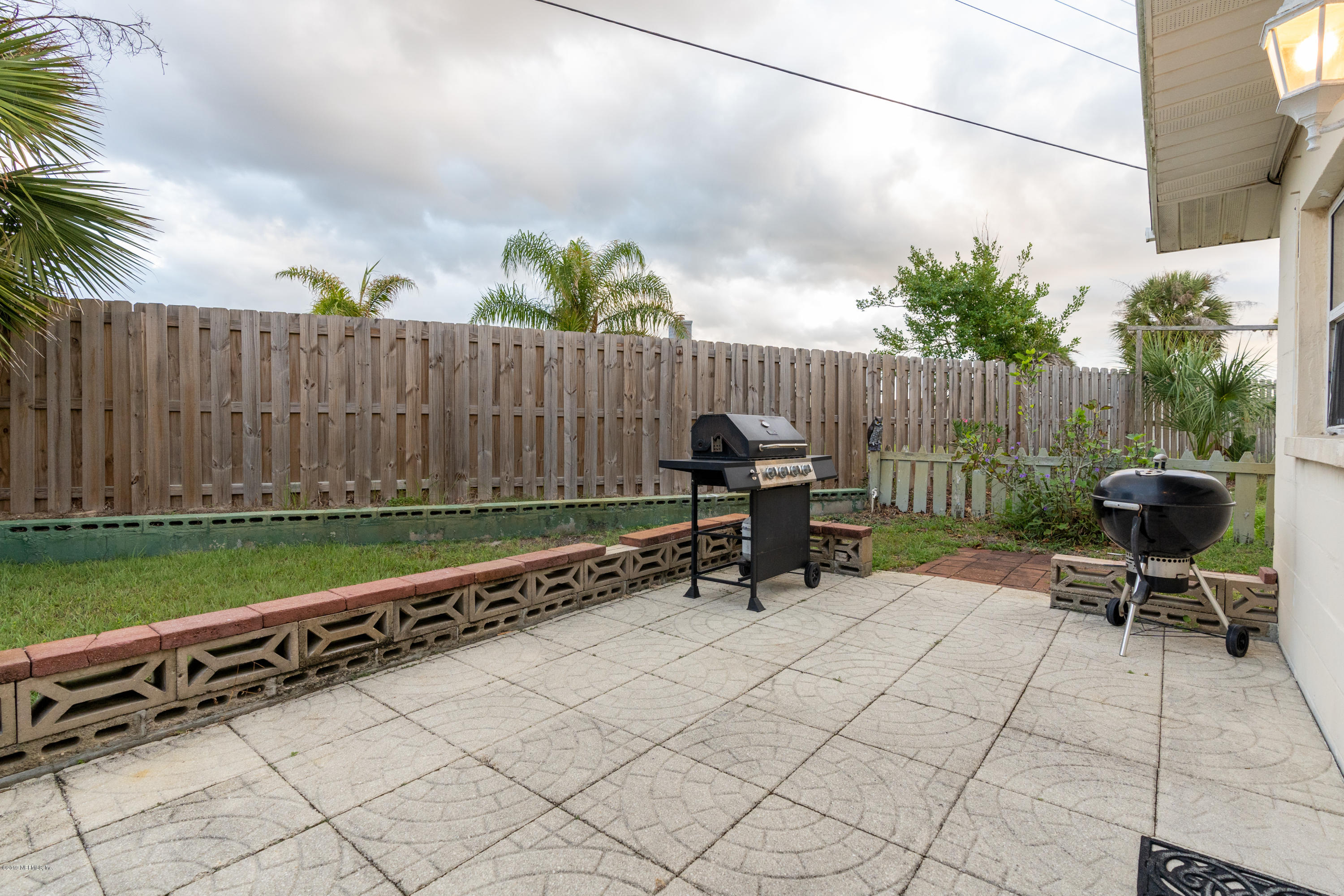 34 Ocean Drive St. Augustine, FL 32080 - Photo 10 of 36 a view of outdoor space with seating area and wooden fence