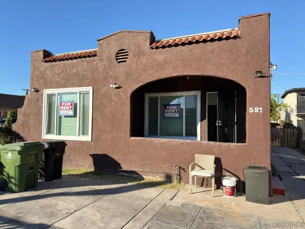 a front view of a house with many windows