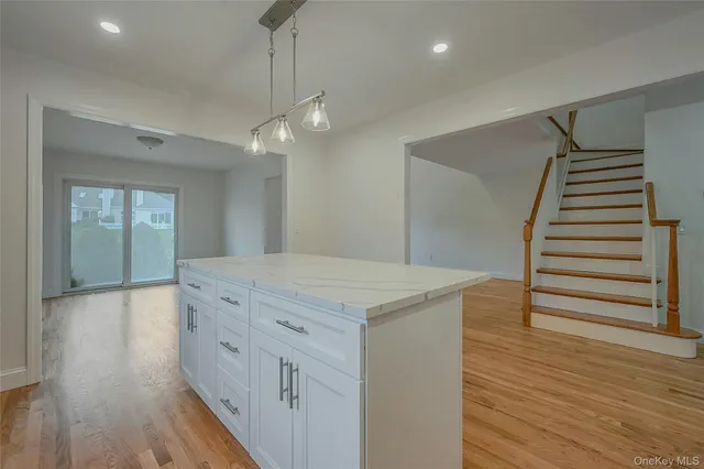 a view of a kitchen cabinets and wooden floor