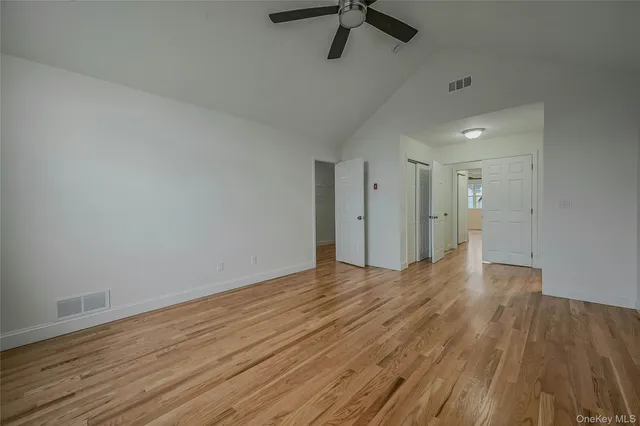 a bathroom with a granite countertop sink a toilet and bathtub