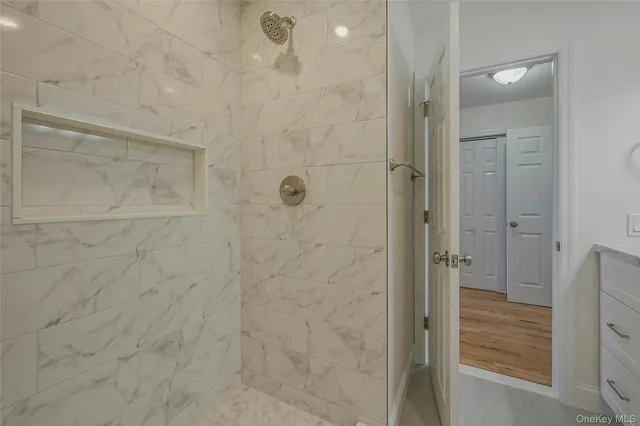 a bedroom with bed and balcony