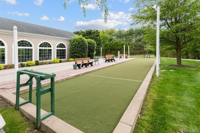 a view of swimming pool with outdoor seating