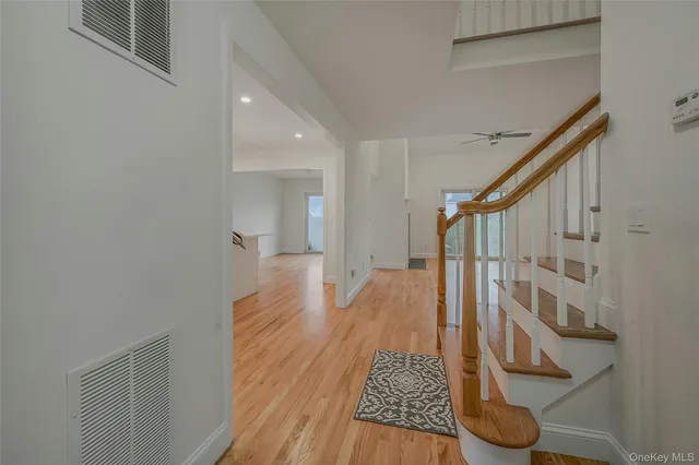 a view of an entryway with wooden floor