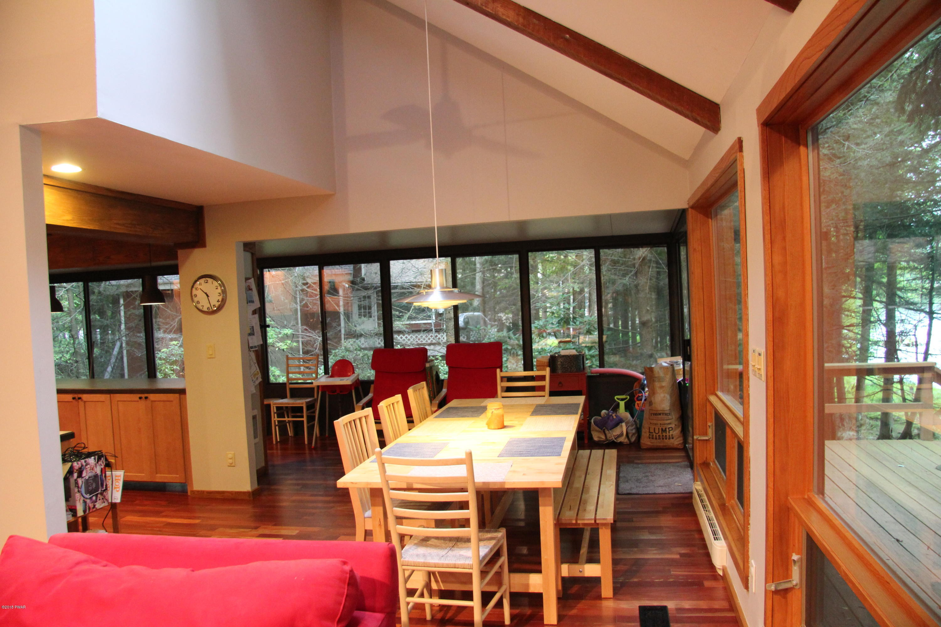 3034 Northgate Road Lake Ariel, PA 18436 - Photo 10 of 38 a dining room with furniture water view and large windows