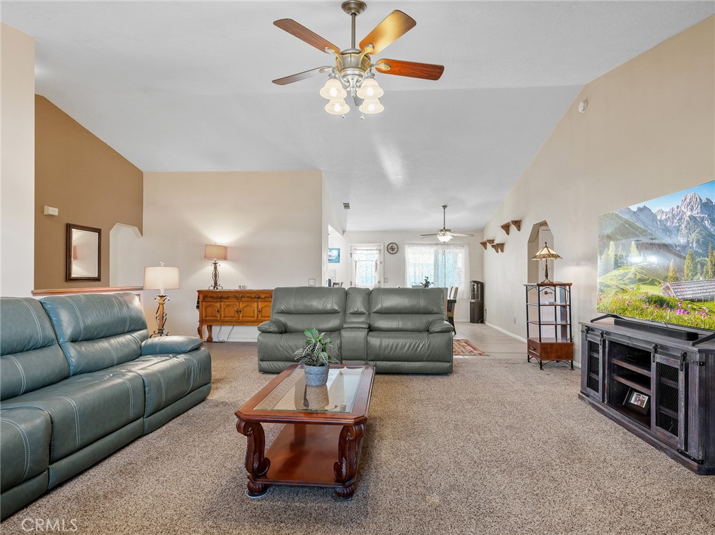13776 Natoma Road Apple Valley, CA 92307 - Photo 14 of 40 a living room with furniture kitchen view and a chandelier