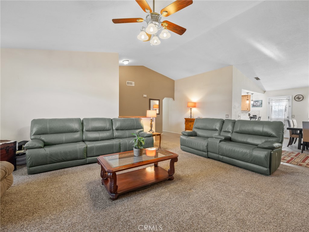13776 Natoma Road Apple Valley, CA 92307 - Photo 15 of 40 a living room with furniture and a ceiling fan