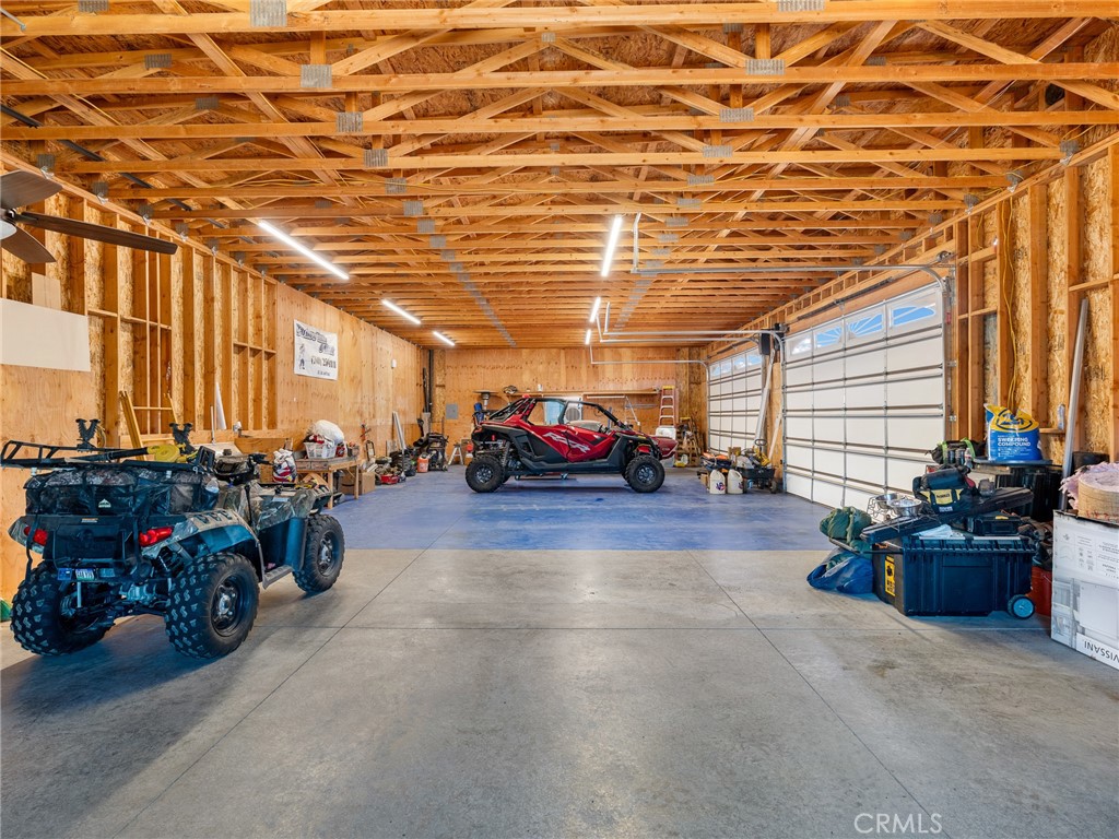 13776 Natoma Road Apple Valley, CA 92307 - Photo 2 of 40 a view of a garage with parked cars