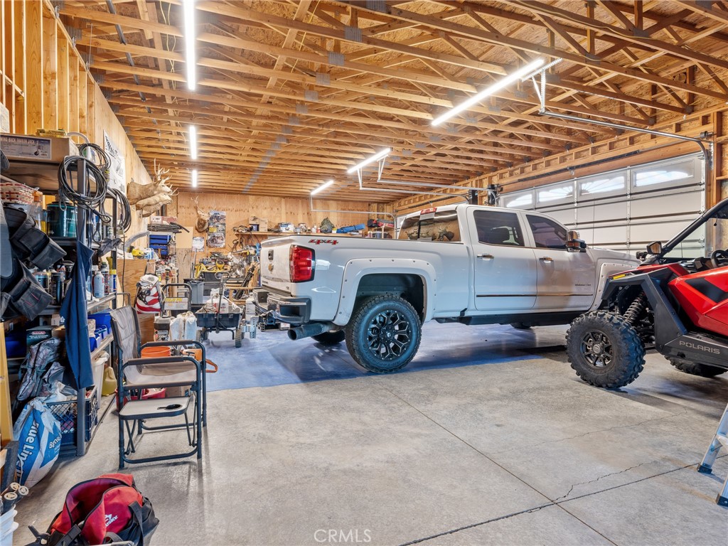 13776 Natoma Road Apple Valley, CA 92307 - Photo 34 of 40 a view of a garage with parked cars
