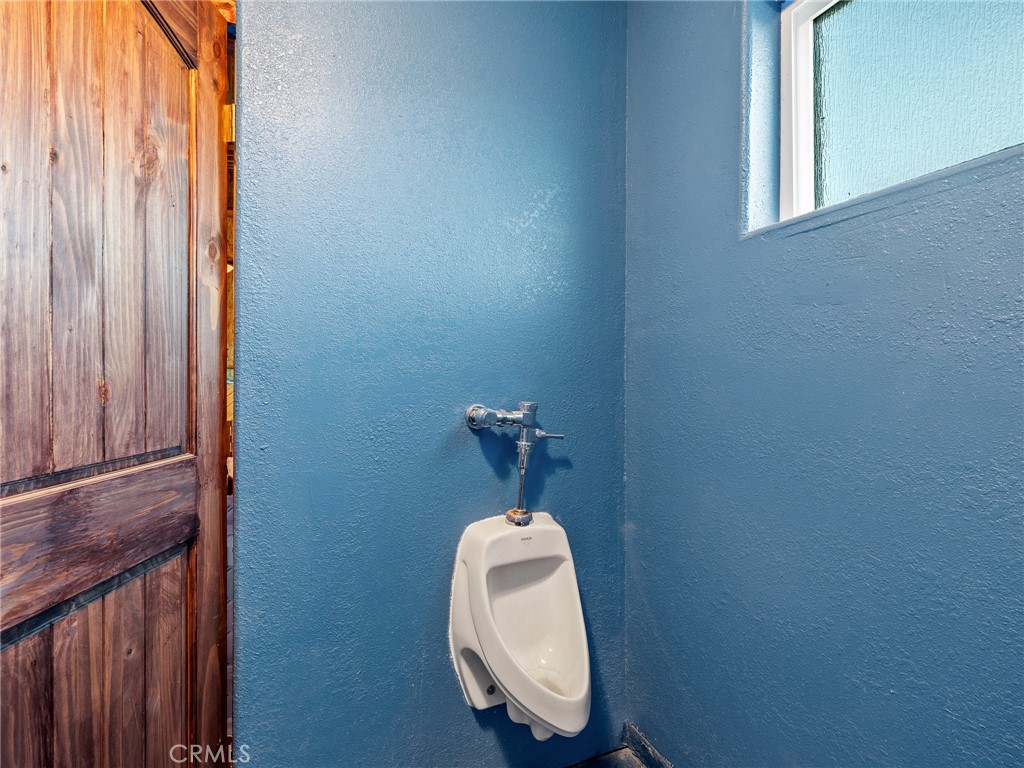 13776 Natoma Road Apple Valley, CA 92307 - Photo 36 of 40 a bathroom with a sink and a mirror