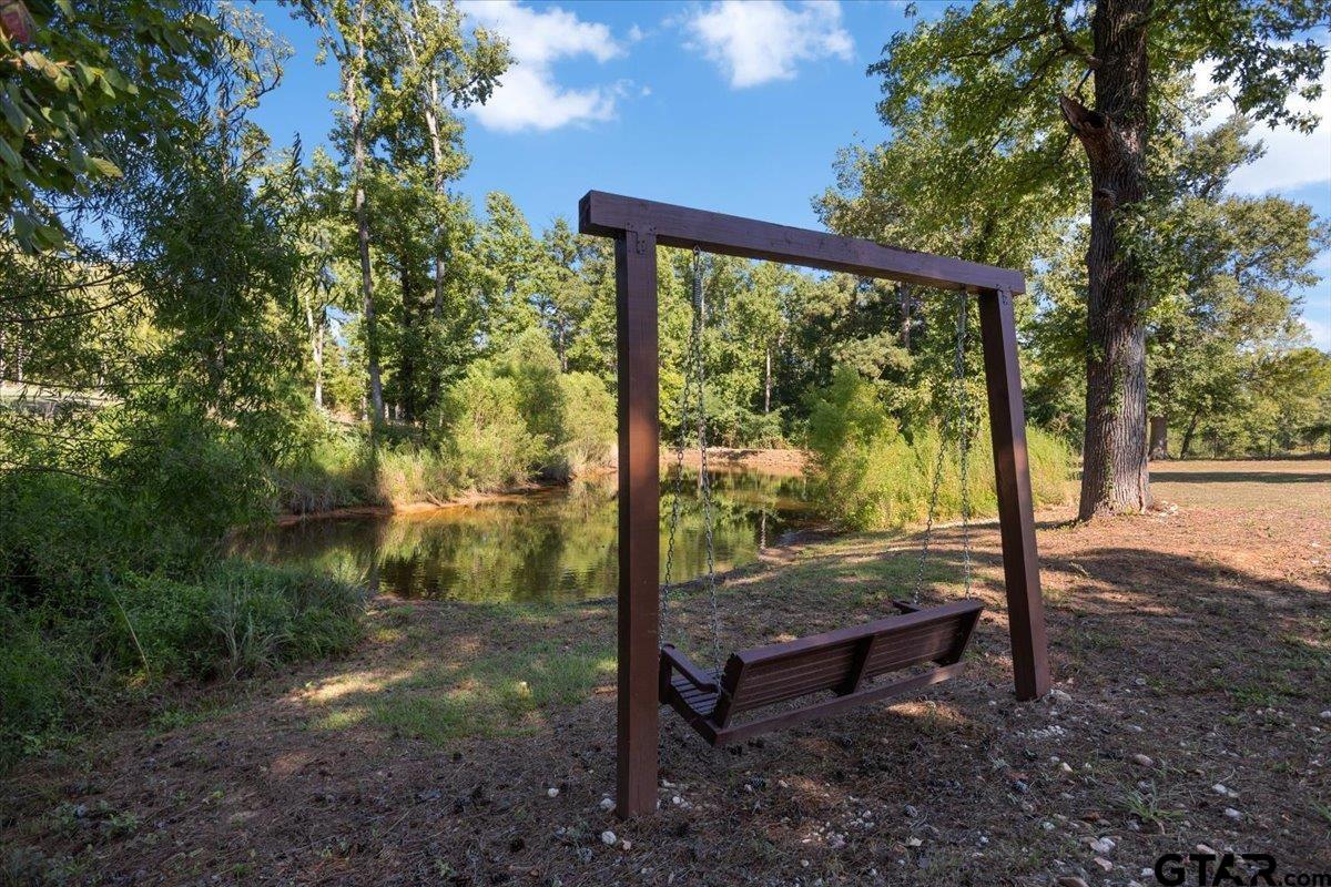2855 County Road 1310 Rusk, TX 75785 - Photo 43 of 49 Swing Overlooking Pond in Front of Home