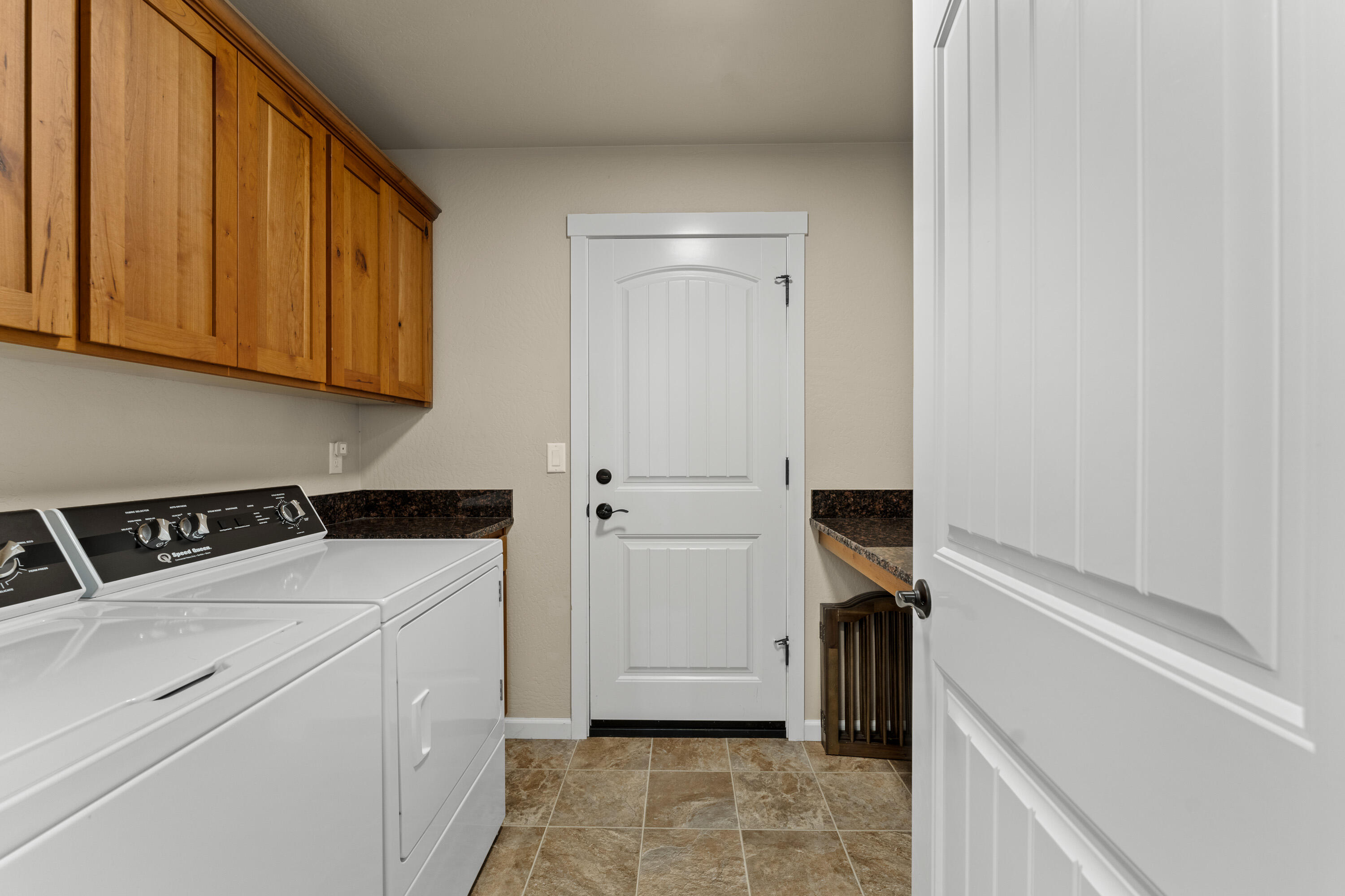 183 Lincoln Road Grants Pass, OR 97526 - Photo 14 of 27 Laundry room with sink, granite, storage and garage access