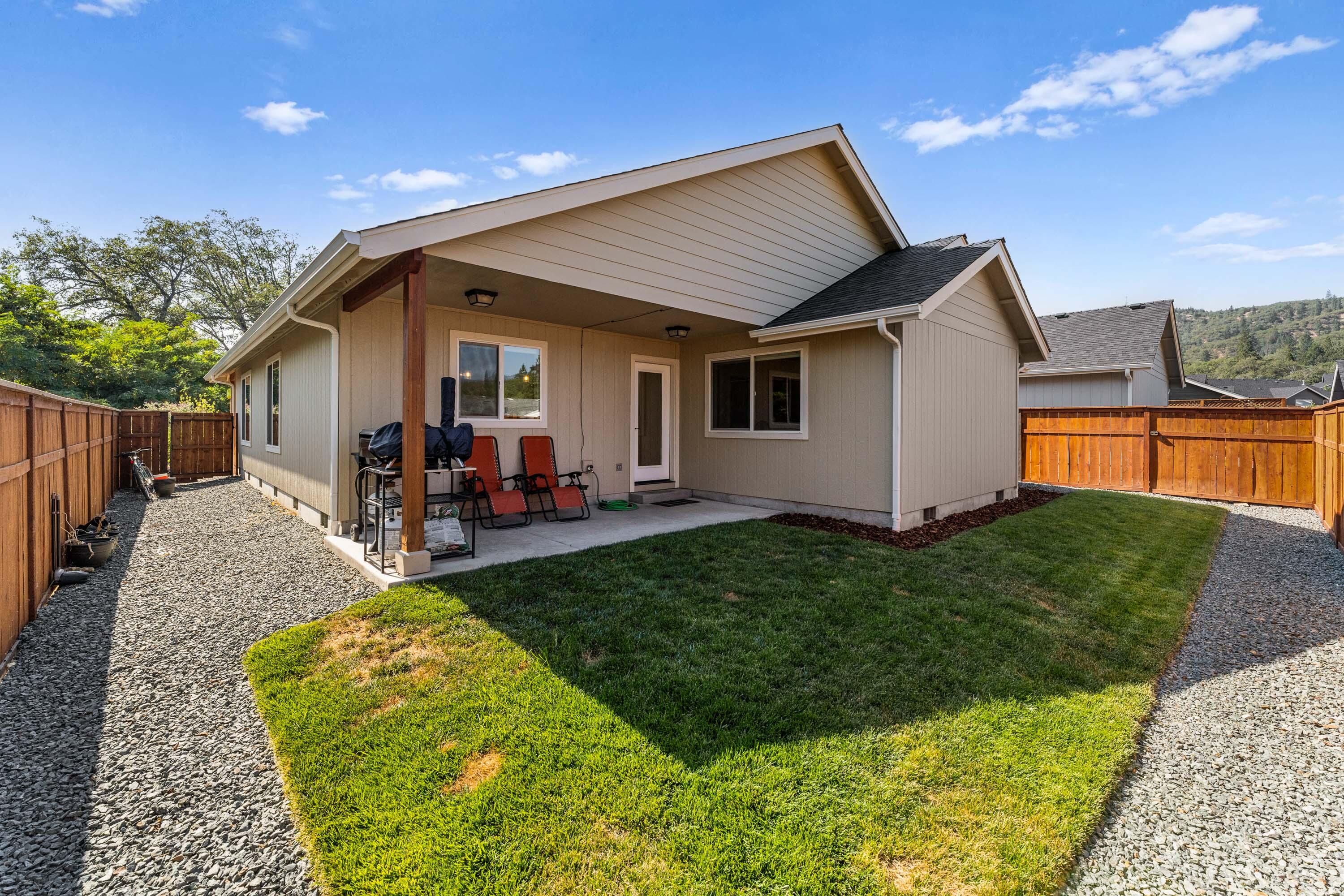 183 Lincoln Road Grants Pass, OR 97526 - Photo 24 of 27 Backyard has been upgraded with faux grass and hot tub. new picture to follow