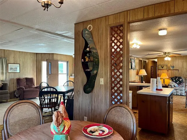 a very nice looking dining room with furniture