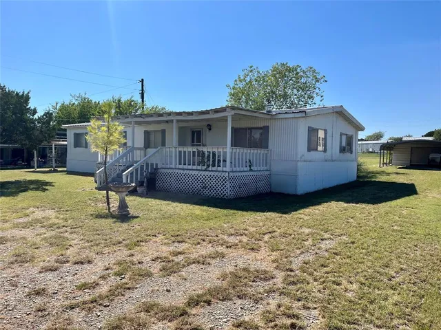 a house view with a garden space