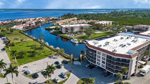 a view of a swimming pool with a patio and a yard